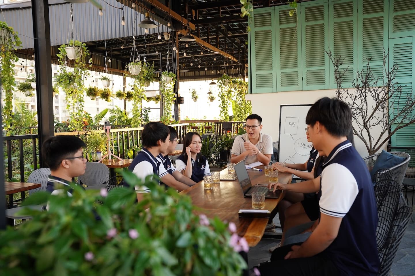 PixiTech team discussing a product around a table